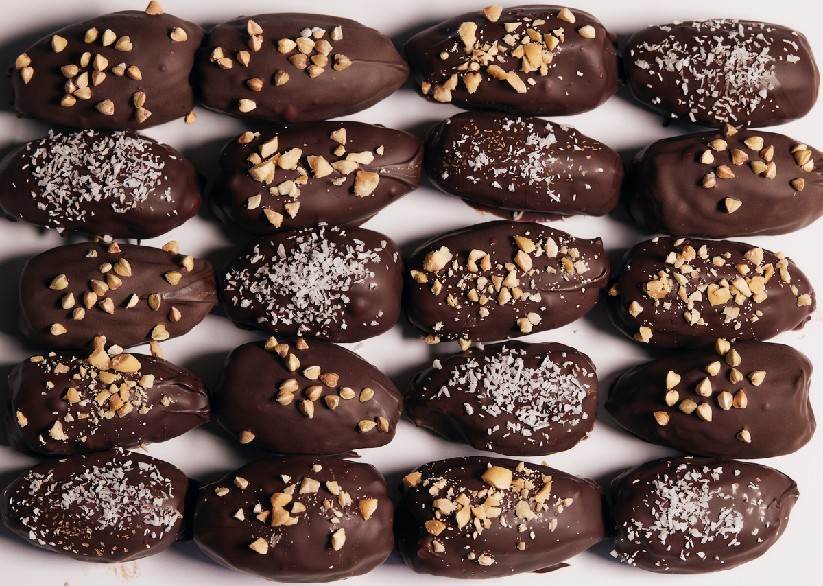 Premium chocolate-coated dates with nut and coconut toppings
